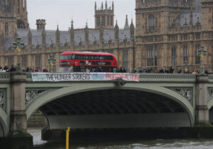 BANNER DROPPED FROM WESTMINSTER BRIDGE WHICH READS ‘WE SUPPORT THE HUNGER STRIKE. WE SUPPORT PALESTINE ACTION’